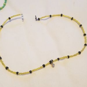 black & gold necklace with charm